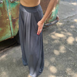 A woman wearing the Charcoal Ribbed Wide Leg Pants with Side Pockets with a cream crochet top.