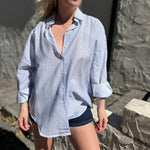 A woman wearing the Striped Button Down Long Sleeve Shirt Top.