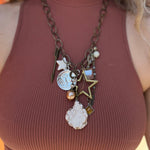 A woman wearing the Gypsy Junk Original Dutton 24" Necklace with a mauve tank.