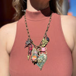 A woman wearing the Gypsy Junk Original-Heart Sorbet 24" Necklace with a mauve tank.