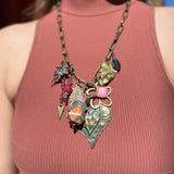 A woman wearing the Gypsy Junk Original-Heart Sorbet 24" Necklace with a mauve tank.