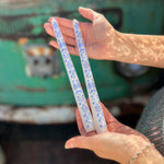 Someone holding the Set of 2 Tapered Coastal Candlesticks.