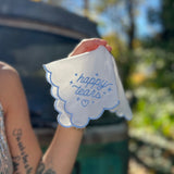Someone holding the Happy Tears Embroidered Handkerchief.