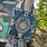 A woman wearing the Sun Bandana Blue Canvas Tote Bag with a skirt and a tan sweater.