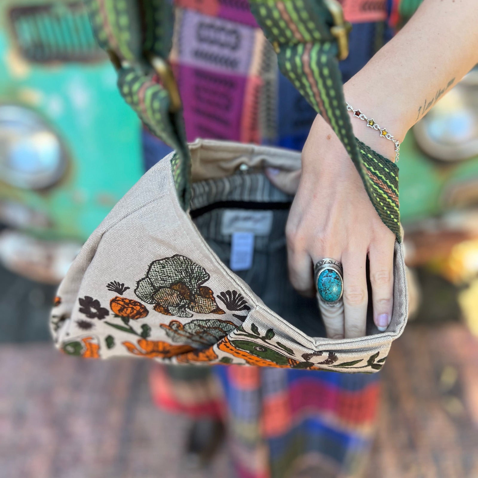 Someone holding the Luna Moth Print Cotton Bag open showing off the inside.