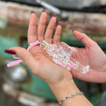 Someone holding the Iridescent Nutcracker Holiday Ornament in front of them.