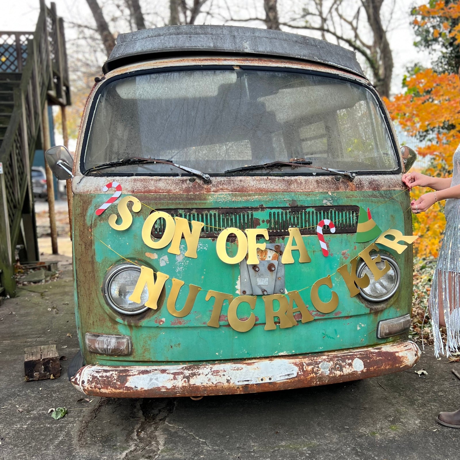 The Son of a Nutcracker Gold Foil Banner on a vintage Volkswagen bus.