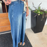 A woman wearing the dark wash Denim Drawstring Waist Band Wide Leg Pants with a cream crocheted top.