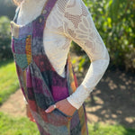 A woman wearing the Vintage Brushed Checkered Overalls with a white long sleeve.