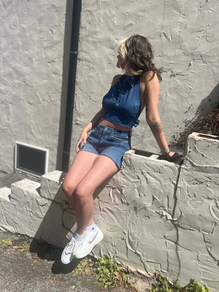 Recycled Denim Halter Top – Upcycled Vintage Shirt on a cream stucko background