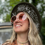 Someone wearing the ivory Bardot Seventies Round Sunglasses with a brown hat and brown kimono.
