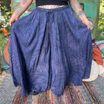 A woman wearing the navy Hippie Bohemian Hand Dyed Palazzo Pants in front of a vintage Volkswagen bus.