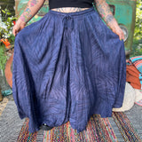 A woman wearing the navy Hippie Bohemian Hand Dyed Palazzo Pants in front of a vintage Volkswagen bus.