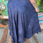 A woman wearing the navy Hippie Bohemian Hand Dyed Palazzo Pants in front of a vintage Volkswagen bus.