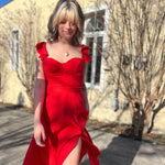 The red heaven corset flutter dress in front of a white background.