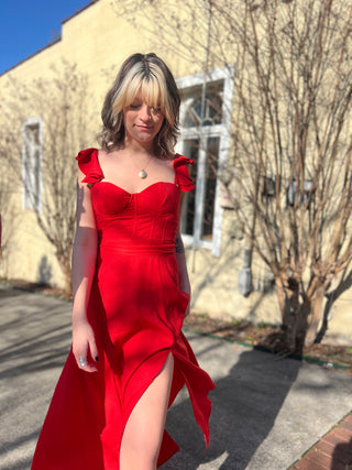The red heaven corset flutter dress in front of a white background.