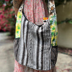Someone wearing the Cotton Hemp Peace Sing Mushroom Shoulder Bag.