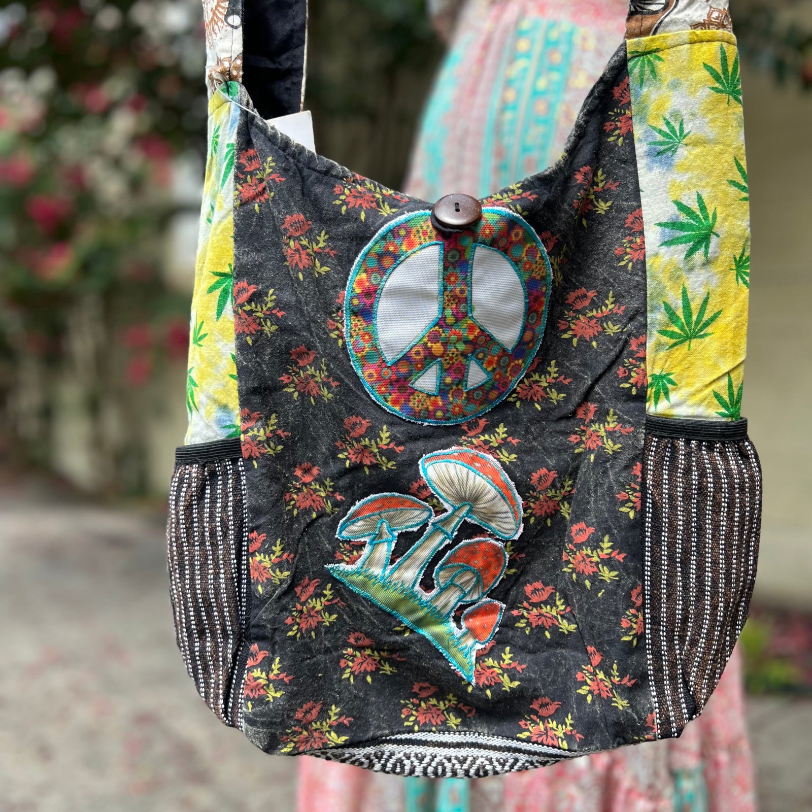 Someone holding the Cotton Hemp Peace Sing Mushroom Shoulder Bag.