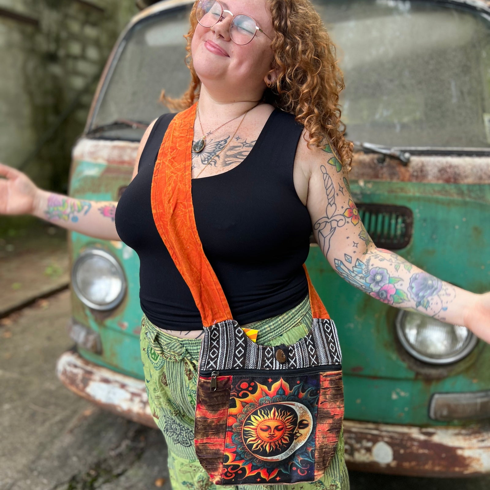 Someone wearing the Cotton Sun Moon Mini Crossbody Bag in front of a vintage Volkswagen bus.