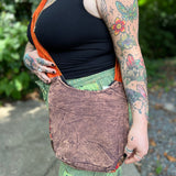 Someone wearing the Cotton Sun Moon Mini Crossbody Bag, showing off the back.