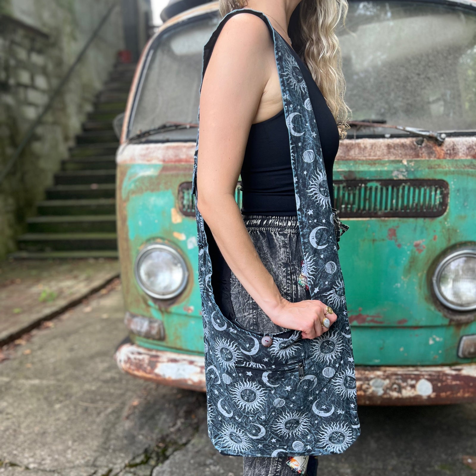 Someone wearing the Cotton Sun Moon Crossbody Bag in front of vintage Volkswagen bus.