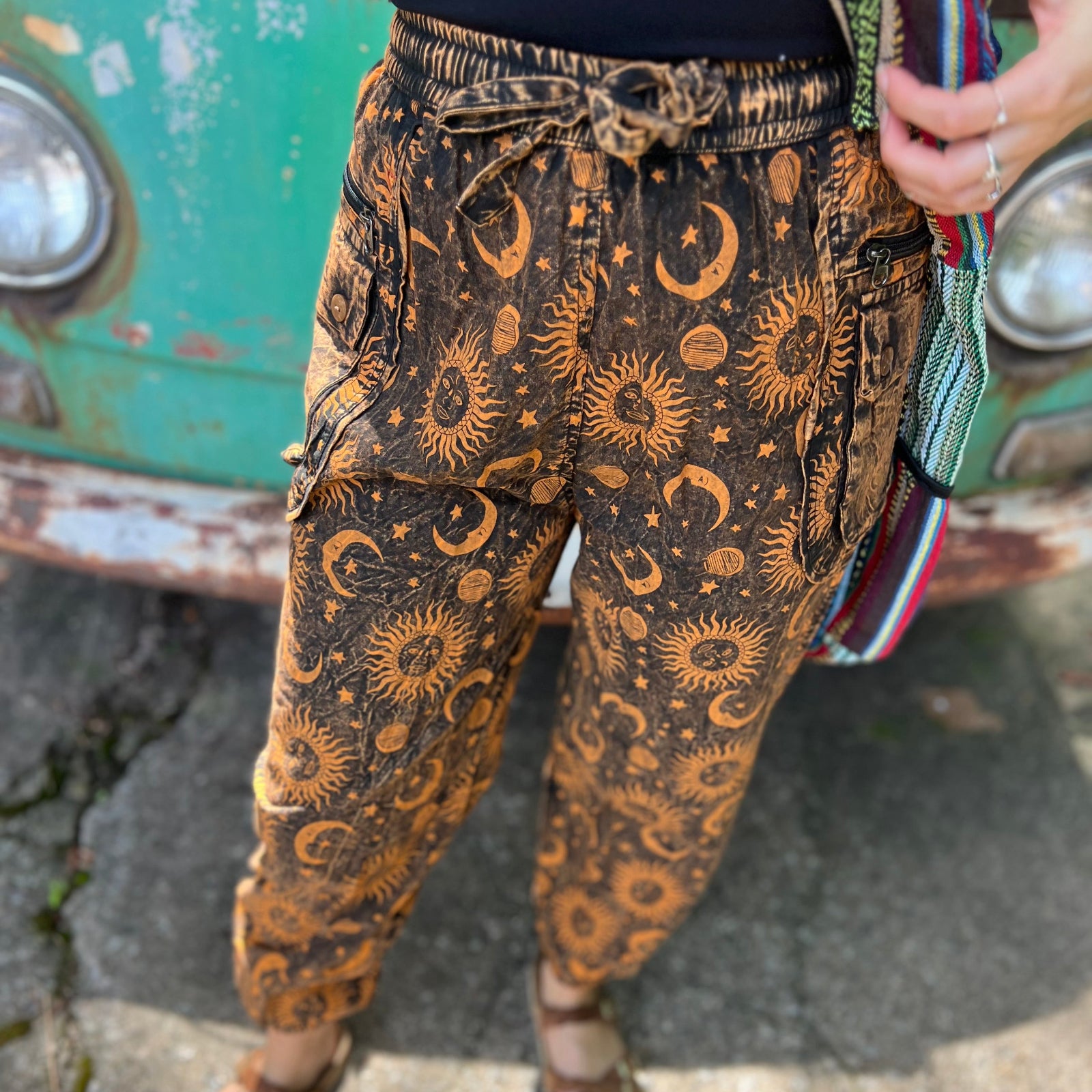 A woman wearing the Cotton Stonewash Golden Sun Moon Cargo Pant in front of a vintage Volkswagen bus.