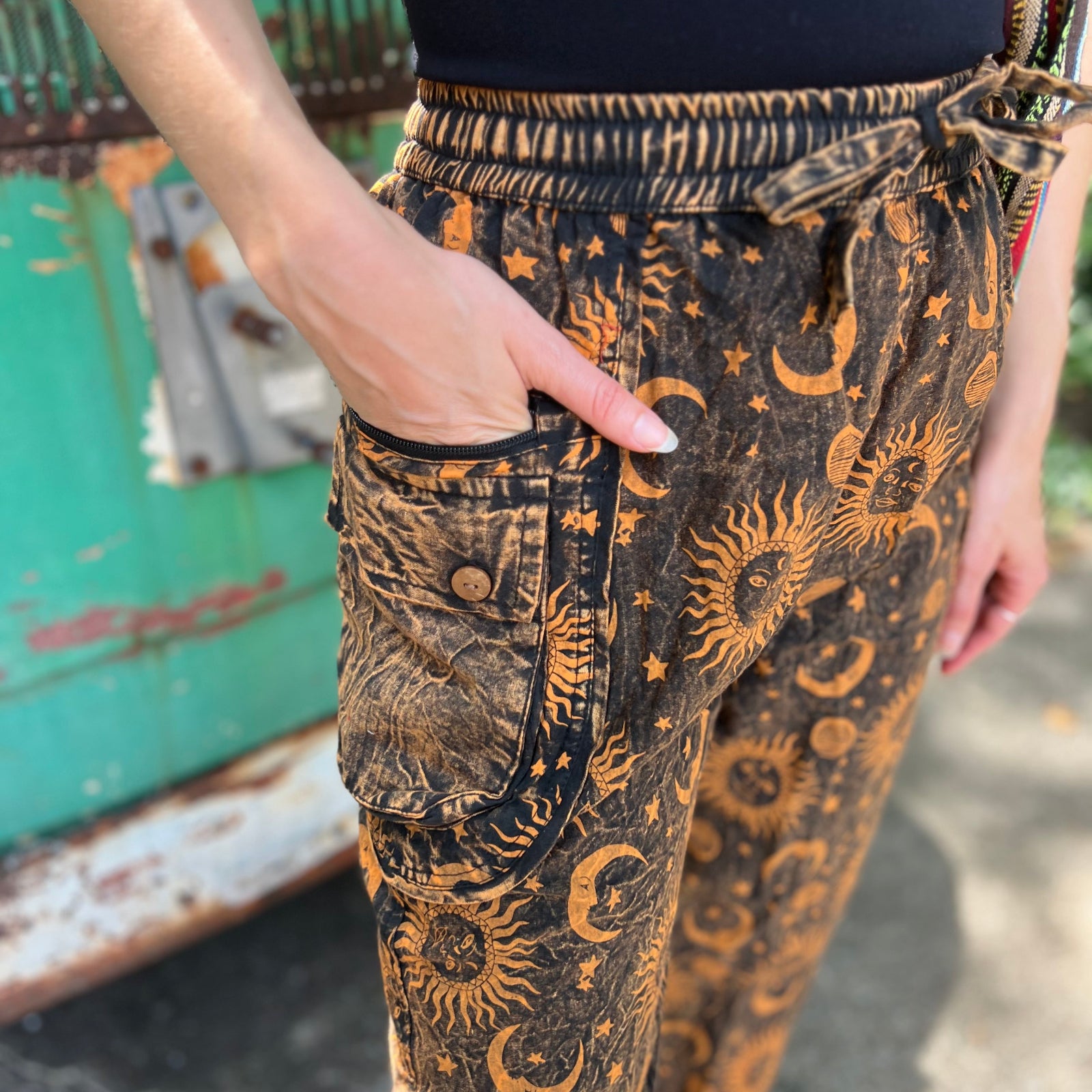 A woman wearing the Cotton Stonewash Golden Sun Moon Cargo Pant in front of a vintage Volkswagen bus.
