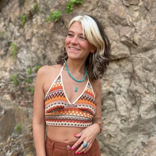 Someone wearing the Bohemian Crisscross Halter Bralette Top.