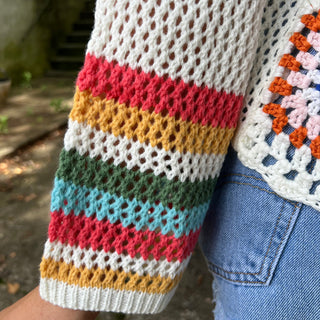 An up-close image of someone wearing the Bohemian Rainbow Crochet Cardigan.