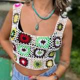 Someone wearing the white Handmade Boho Crochet Design Camisole in front of an old teal Volkswagen bus.