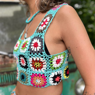 Someone wearing the blue Handmade Boho Crochet Design Camisole in front of an old teal Volkswagen bus.