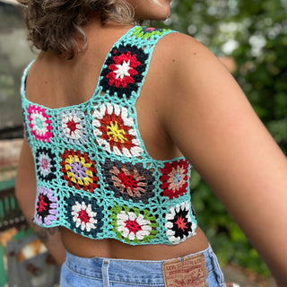 Someone wearing the blue Handmade Boho Crochet Design Camisole in front of an old teal Volkswagen bus.
