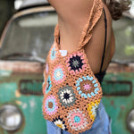 Someone wearing the khaki Bohemian Handmade Crochet Bag.