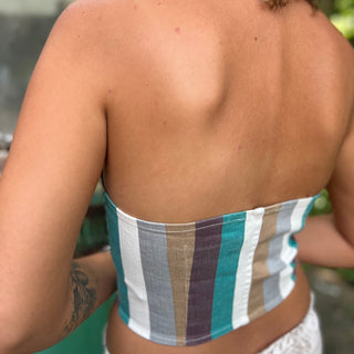 Someone wearing the turquoise multi Retro Striped Denim Halter Vest Top.