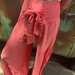Someone wearing the coral Smocking Waist Tier Wide Pants.