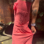 Someone wearing the coral Smocking Waist Tier Wide Pants.