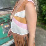 A woman wearing the camel Retro Sunburst Suede Color Block Long Fringe Faux Vest.