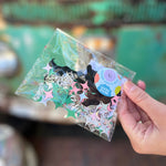 Someone holding the Wicked Witch 200 Piece Confetti bag.