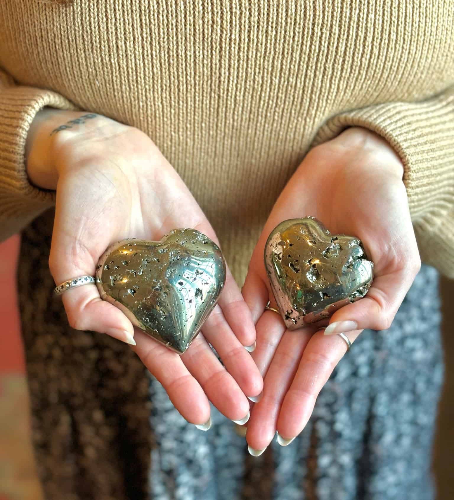 pyrite crystal hearts in palms