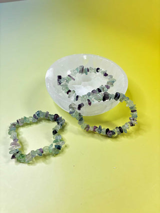 Rainbow Fluorite Crystal Chip Bracelets in Selenite Crystal Bowl over Yellow background