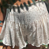 Someone wearing the Taupe Bandana Shorts with Elastic Waist.