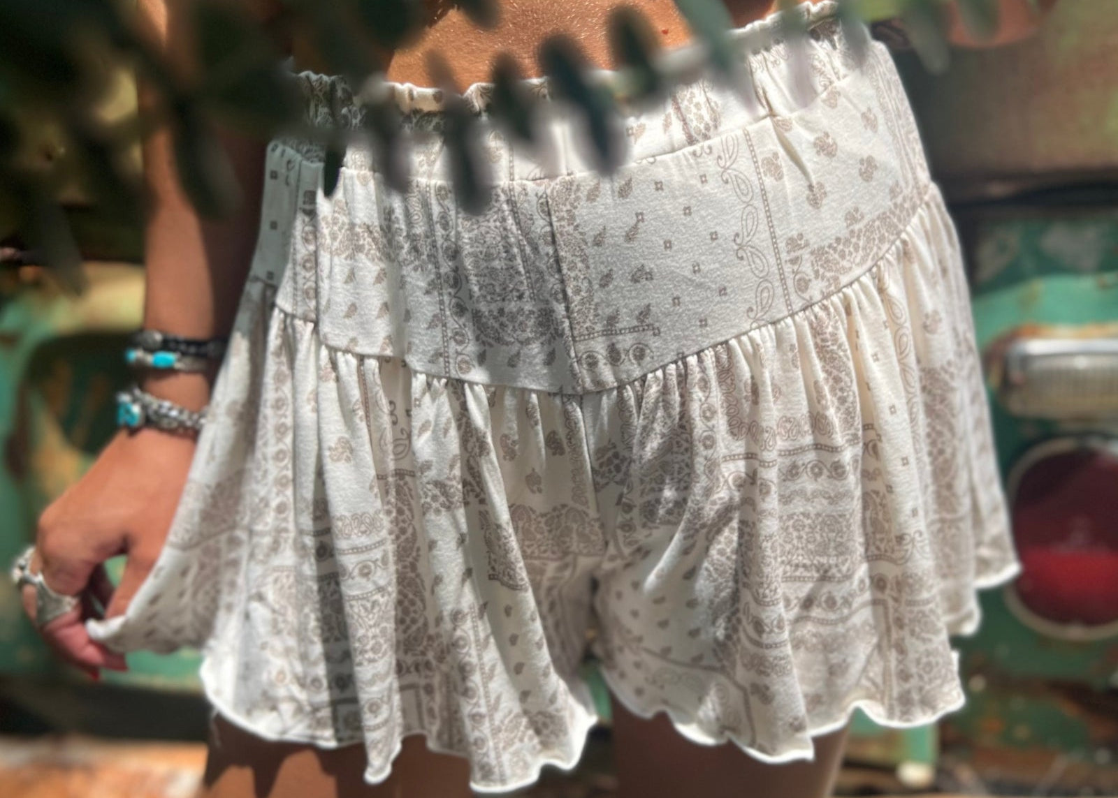 Someone wearing the Taupe Bandana Shorts with Elastic Waist.