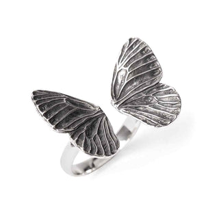 Silver butterfly wing ring on a white background