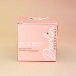 Pink box of Darlin Skincare Tallow Balm on a beige background