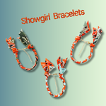 Showgirl bracelets with colorful designs on a light green background
