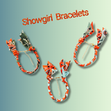 Showgirl bracelets with colorful designs on a light green background