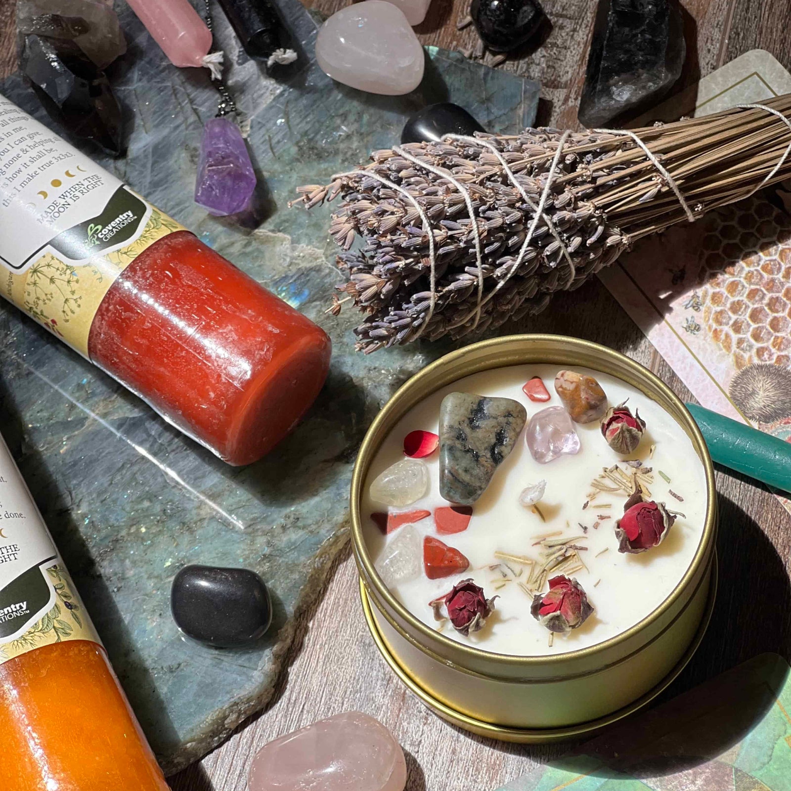 Zodiac Candle with natural elements on a stone surface with crystals and herbs.