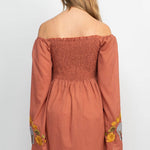 The clay elephant embroidery dress on a white background.