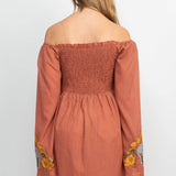 The clay elephant embroidery dress on a white background.