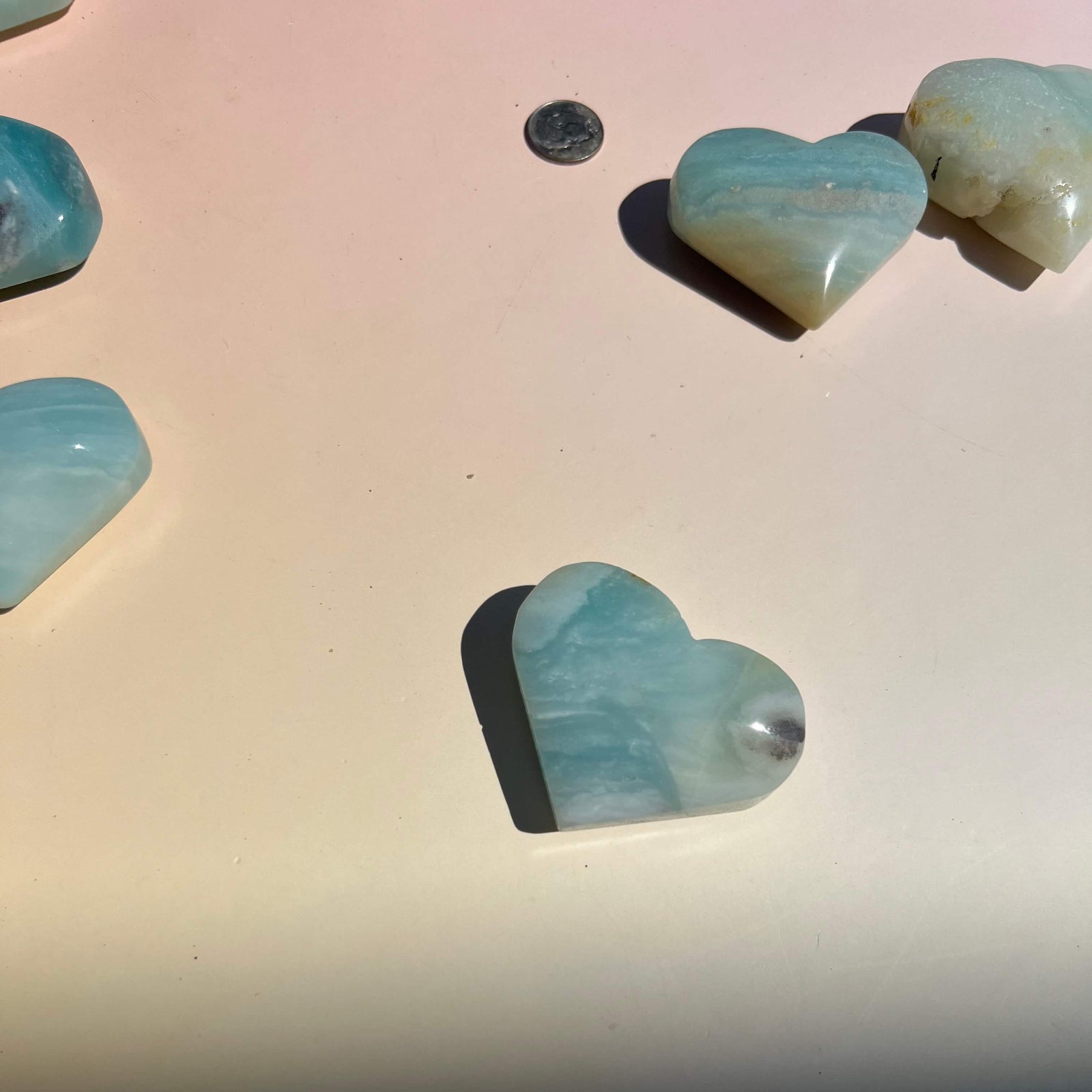 Polished Amazonite crystal heart with natural blue green coloring